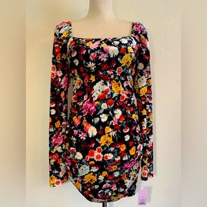 Size medium long sleeved ruched mini dress.